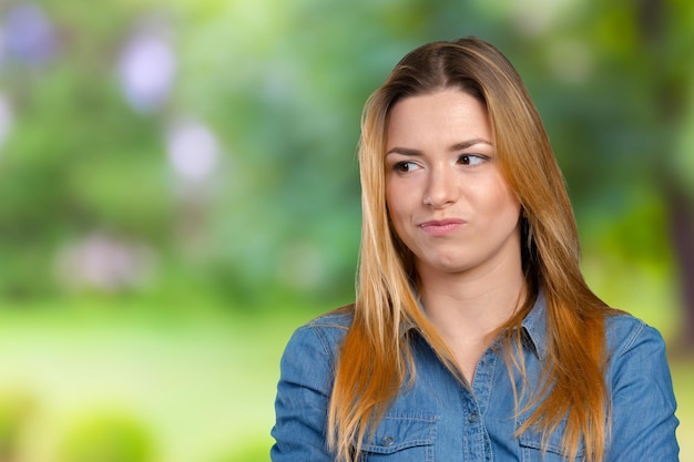 Portrait of the young thinking woman