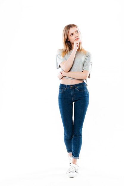 Portrait of a young thoughtful woman looking away