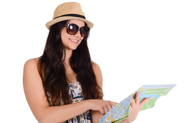 Portrait of young traveler woman looking at map