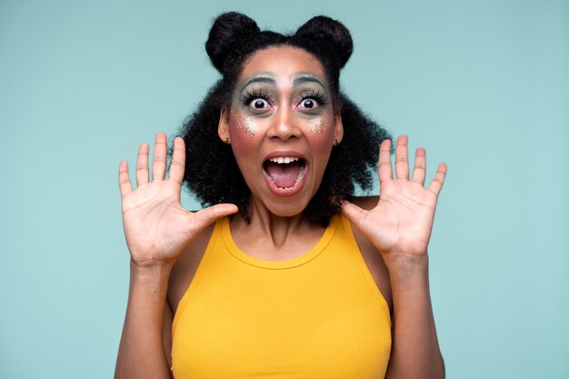 Portrait of a young woman being surprised and wearing make-up