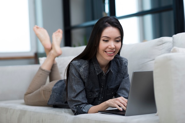 Portrait of young woman on the couch