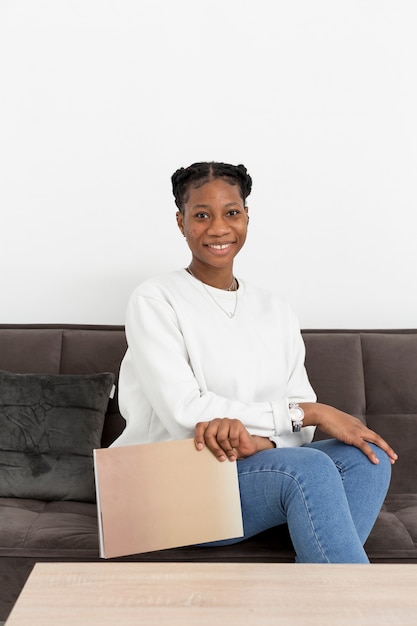 Portrait young woman on couch