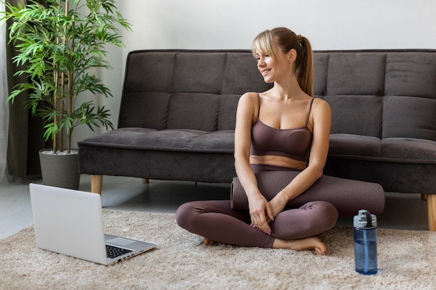 Portrait young woman exercising at home