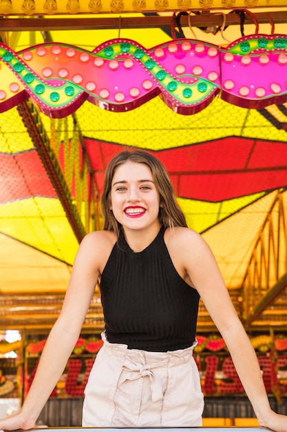 Portrait of a young woman at fairground