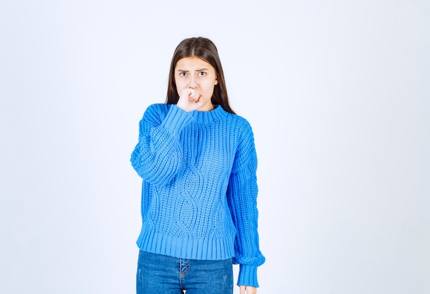 Free photo portrait of young woman feeling scared on white.