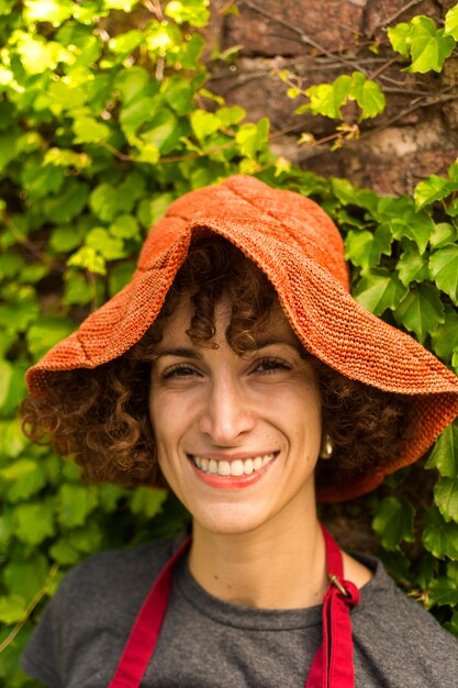 Portrait of young woman gardening