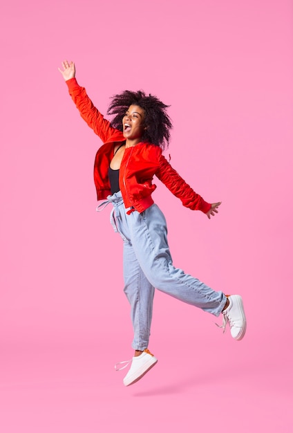 Portrait young woman jumping