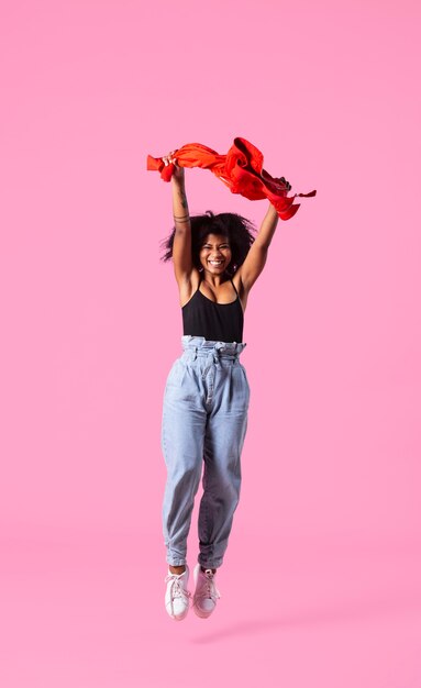 Portrait young woman jumping