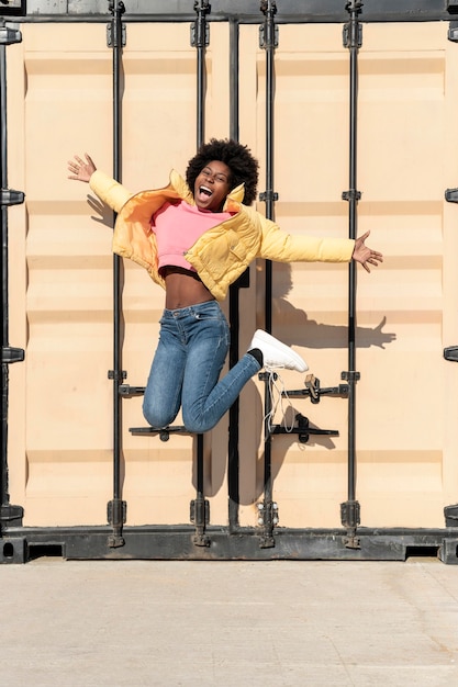 Portrait young woman jumping