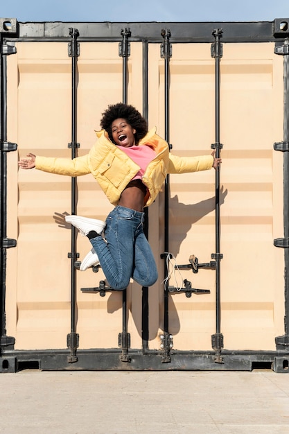 Free photo portrait young woman jumping