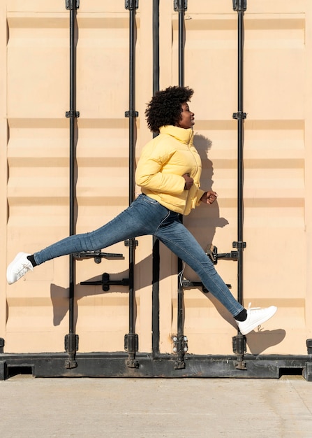 Portrait young woman jumping