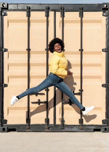 Portrait young woman jumping