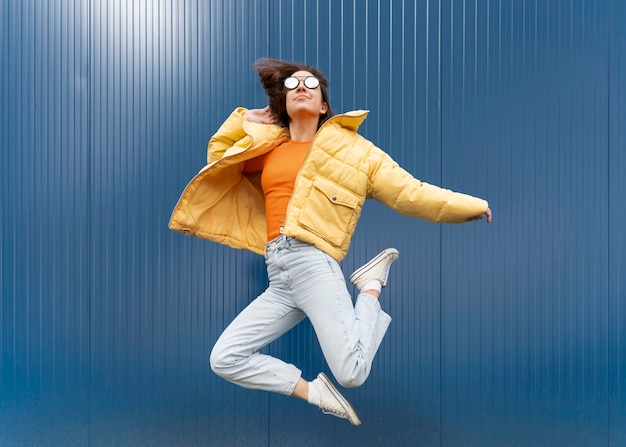 Portrait young woman jumping