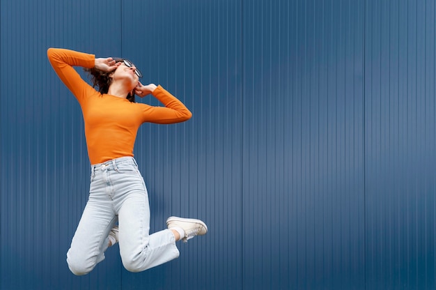 Portrait young woman jumping