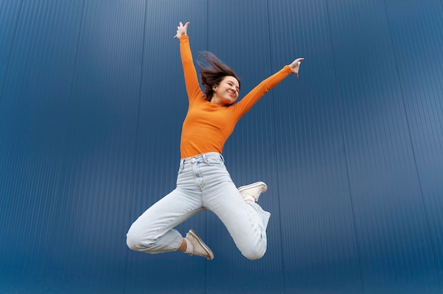 Portrait young woman jumping