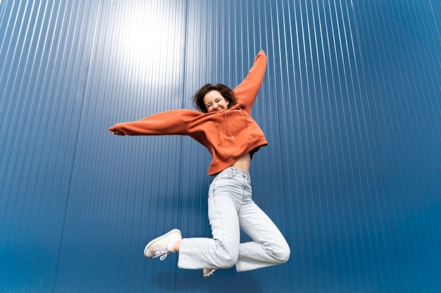 Portrait young woman jumping