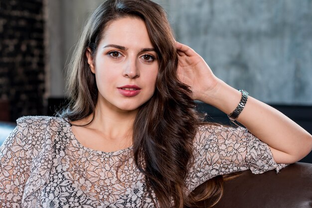 Portrait of a young woman looking at camera