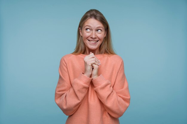 Portrait of a young woman looking hopeful