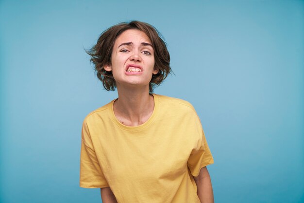 Portrait of a young woman looking silly