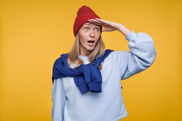 Portrait of a young woman looking surprised