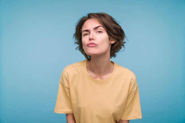 Portrait of a young woman looking suspicious