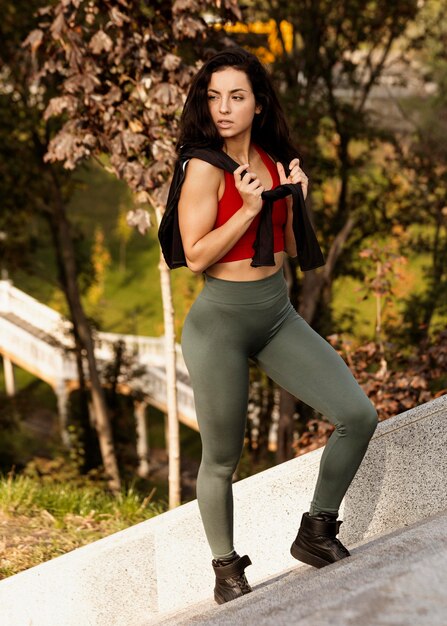 Portrait of young woman posing outdoors