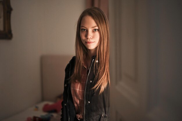 portrait of young woman in a room with open door