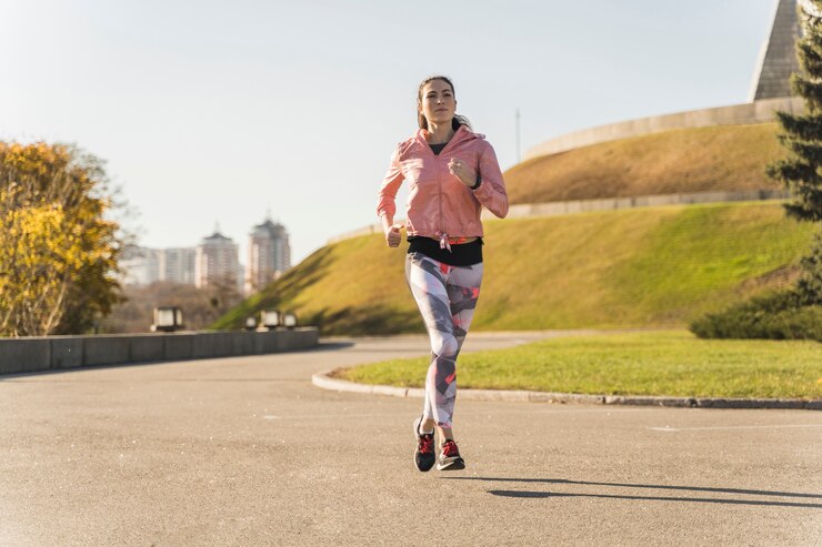 Free Photo portrait of young woman running outdoor