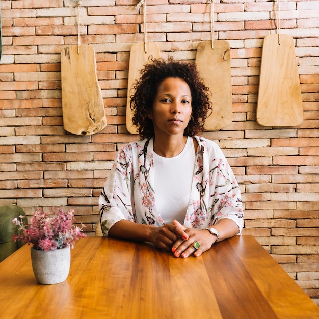 Portrait of young woman sitting in the restaurant