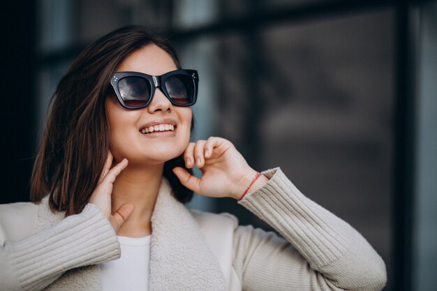 Portrait of young woman in town