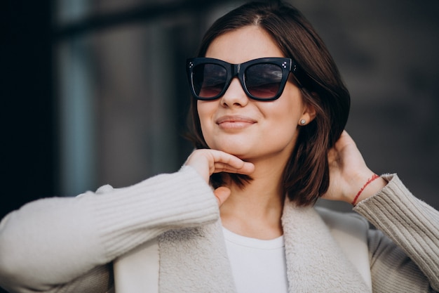 Portrait of young woman in town