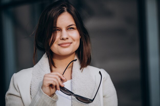 Portrait of young woman in town