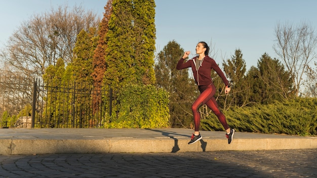 Portrait of young woman training outdoor