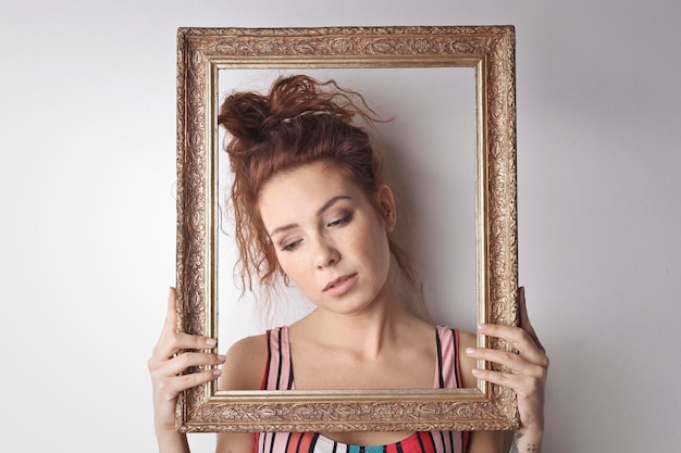 portrait of young woman in a vintage frame