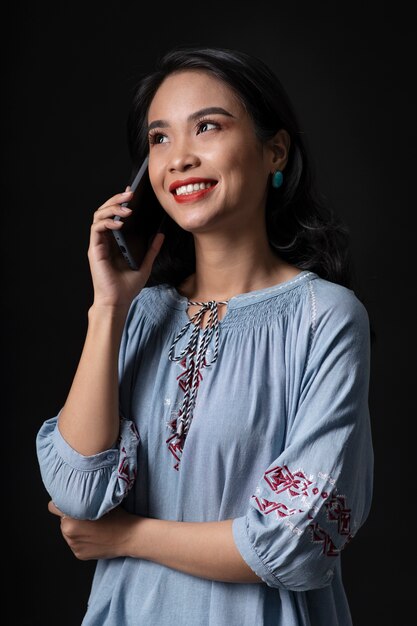 Portrait of young woman wearing embroidered shirt