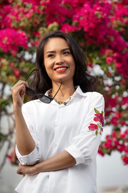 Portrait of young woman wearing embroidered shirt