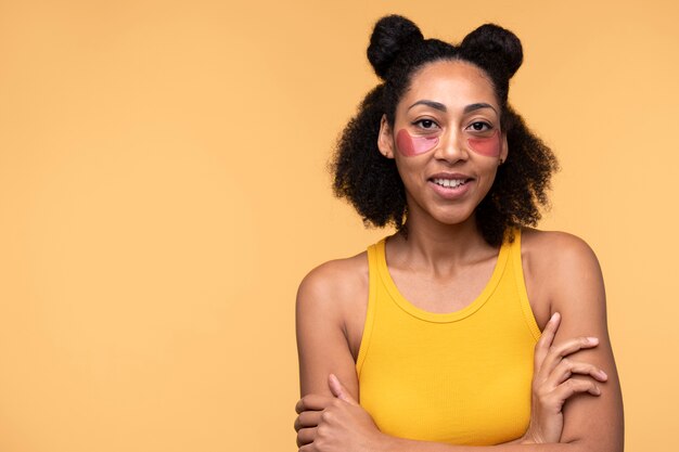 Portrait of a young woman wearing under-eye patches