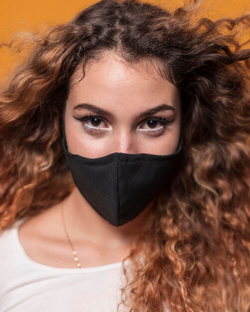 Portrait young woman wearing mask