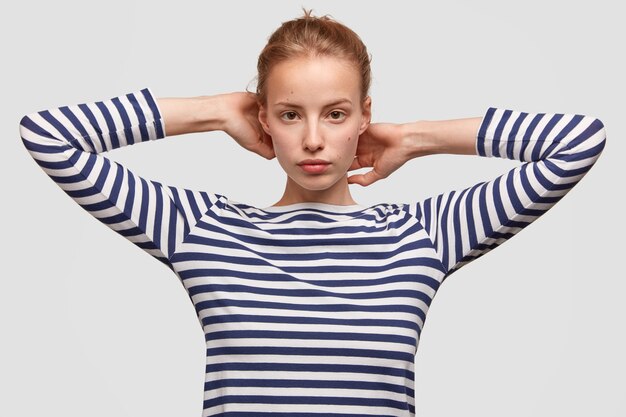 Portrait of young woman wearing striped blouse