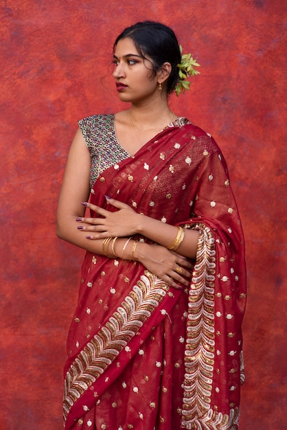 Free photo portrait of young woman wearing tradition sari garment