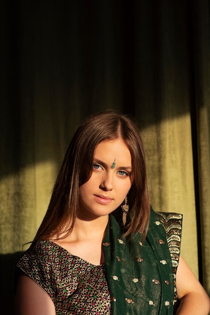 Free photo portrait of young woman wearing traditional sari garment