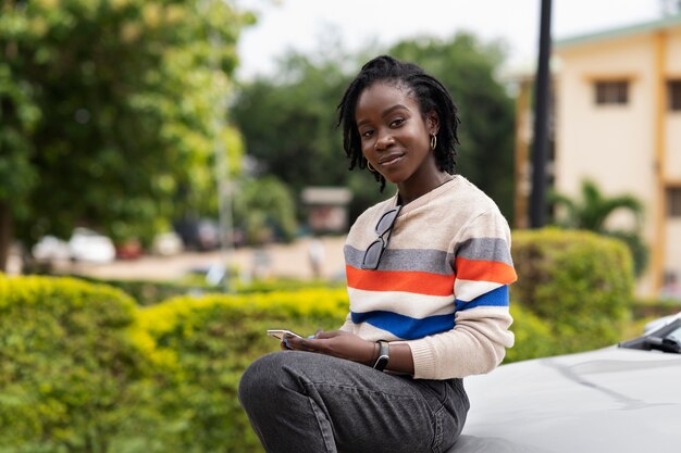 Portrait of young woman with afro dreadlocks