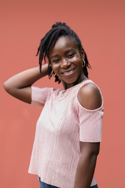 Portrait of young woman with afro dreadlocks