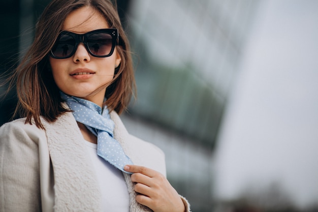 Portrait of young woman with blue scarf