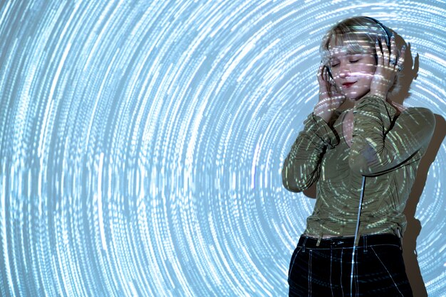 Portrait of young woman with universe projection texture