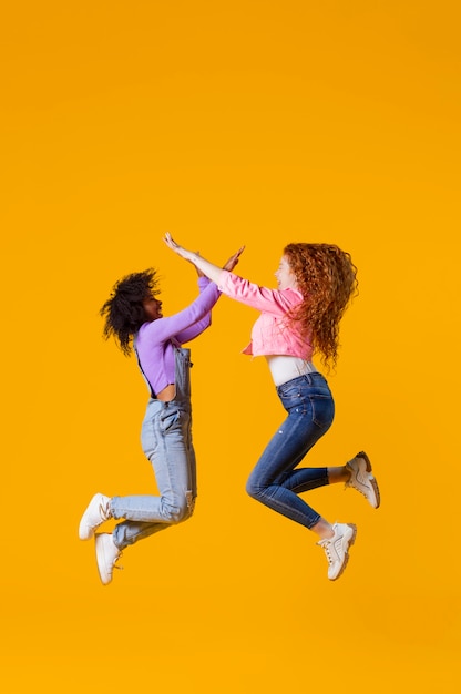 Free photo portrait young women jumping