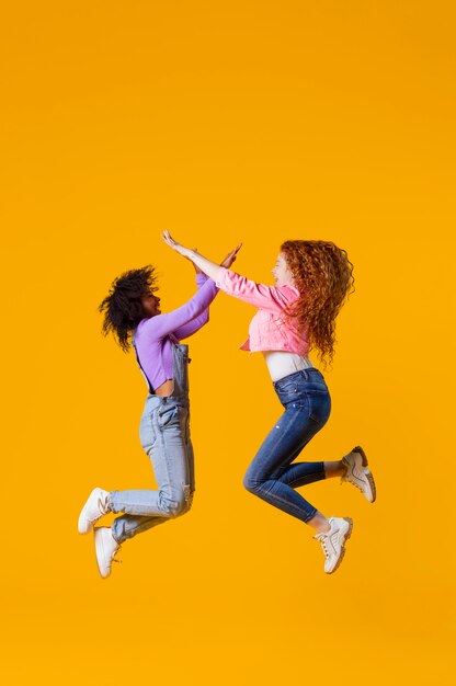 Portrait young women jumping