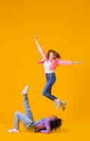 Free photo portrait young women jumping