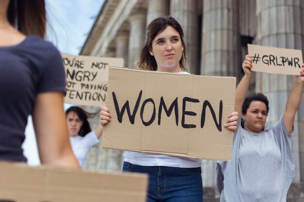 Portrait of young women protesting together