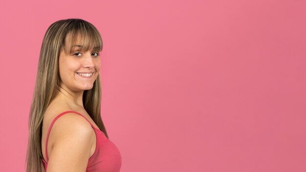 portriat young woman sideway looking at camera